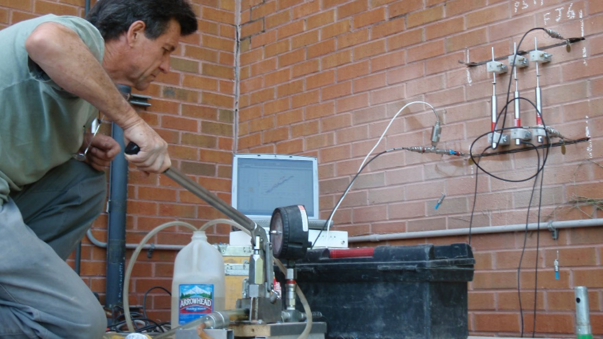 Figure 2. In situ testing of masonry compressive strength using flatjacks. Figure 2. In situ testing of masonry compressive strength using flatjacks.